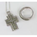 Modern diamond cross pendant, forty four green round cut diamonds with a border of twenty six