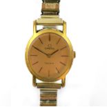 Lady's Omega gold plated watch the oval dial with gold batons signed Omega Geneve, within an oval