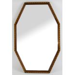 Mirror of octagonal form with frame in Cotswold school manner, detailed parquetry border with a