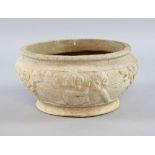 Compton pottery unglazed bulb pot the frieze decorated with Putti and floral sprays, 22 cm diameter,