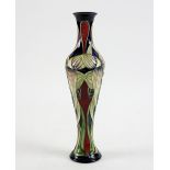 Emma Bossons a Moorcroft slender tapering form vase with formal decoration of flowers, dated 2003,