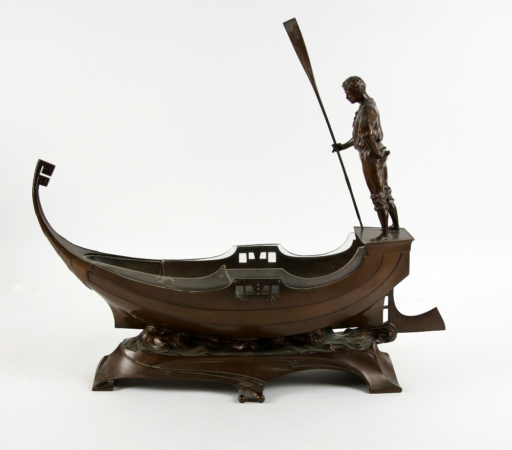 WMF, a large centrepiece in the form of a gondola with gondolier, bronze finish, stamped marks to