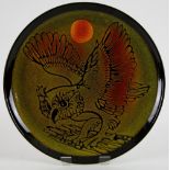 Carolyn Wills for Poole Pottery, a charger decorated with a sunlit owl, monogram and factory marks,