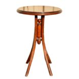 An early 20th century bentwood table with circular top. 76 x 51 cm. A table on similar base is