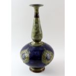 Doulton large stoneware bottle vase, underglaze painted in tones of blue, green and brown, with tube