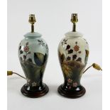 Two Moorcroft lamp bases in blackberry bramble pattern, one on cream ground another blue, 26.5 cm