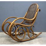 Early 20th C Bentwood rocking chair with caned seat and back, the rockers with metal rails,