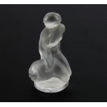 Lalique glass figure of Leda and the swan, frosted glass on clear circular base, engraved, Lalique