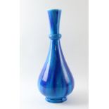 A large Mintons vase, with streaked blue glaze, impressed date cipher for 1892 and numbered 1600,