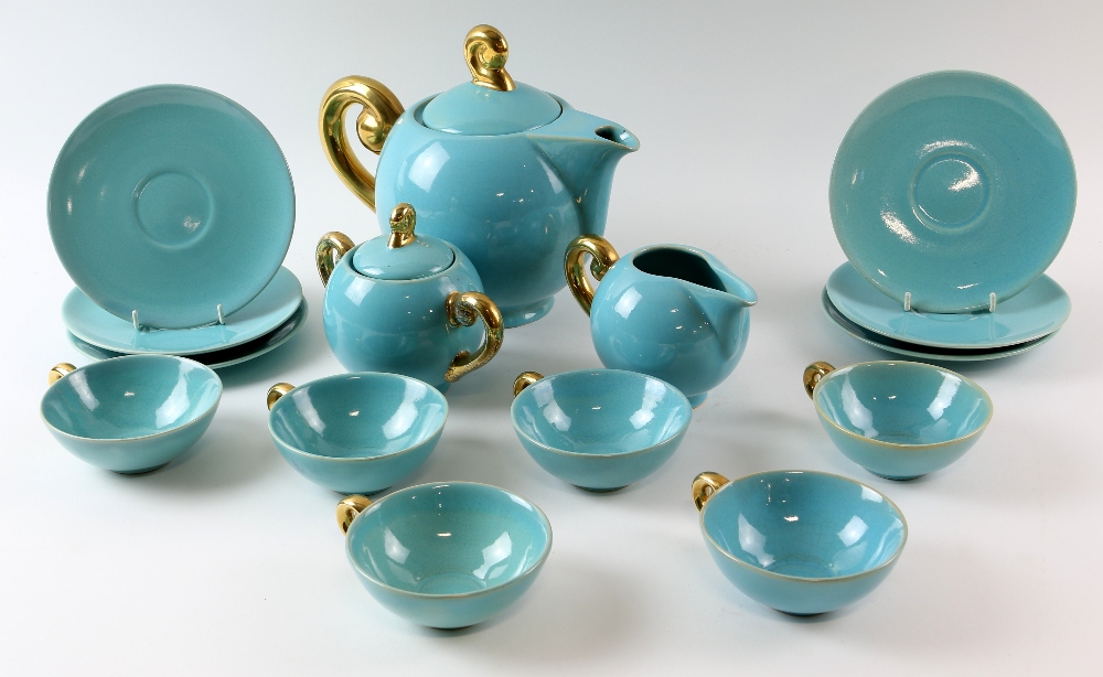 Roger Guerin, Belgian, blue glazed tea service with gilt scroll handles, tea pot, sugar bowl, cream