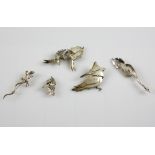 Amanda Birkitt, Silversmith, five brooches, lion head and arrow pin, a griffin, two birds of prey,
