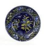 Antoine Montagnon French faience charger decorated with birds in flight and flowers on a midnight