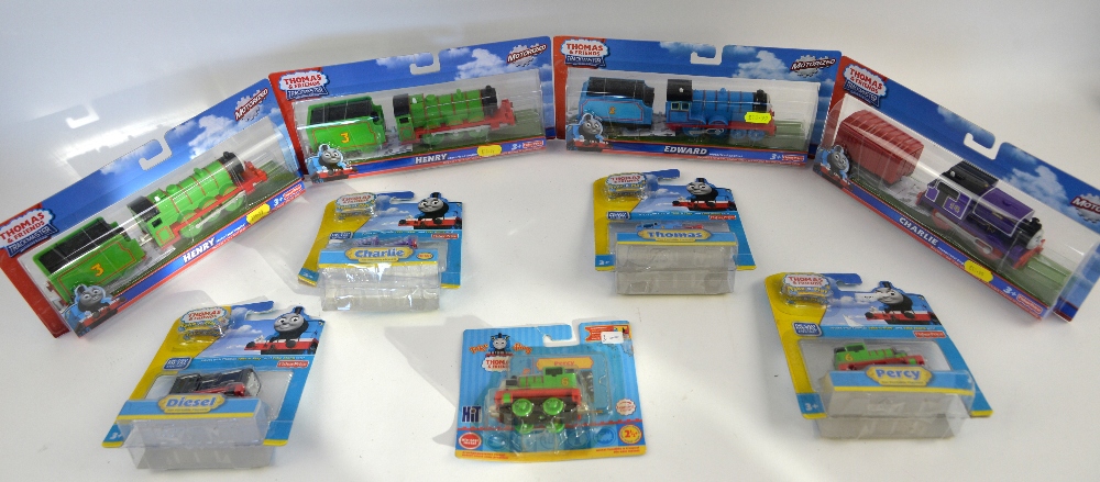 Nine Fisher Price Thomas the Tank Engine 'Trackmaster' and 'Take-n-Play' models, boxed as new. (9)