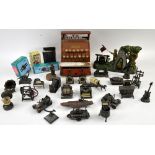 A tin plate Codeg child's imitation cash register, a cast iron boy scout model and a collection of