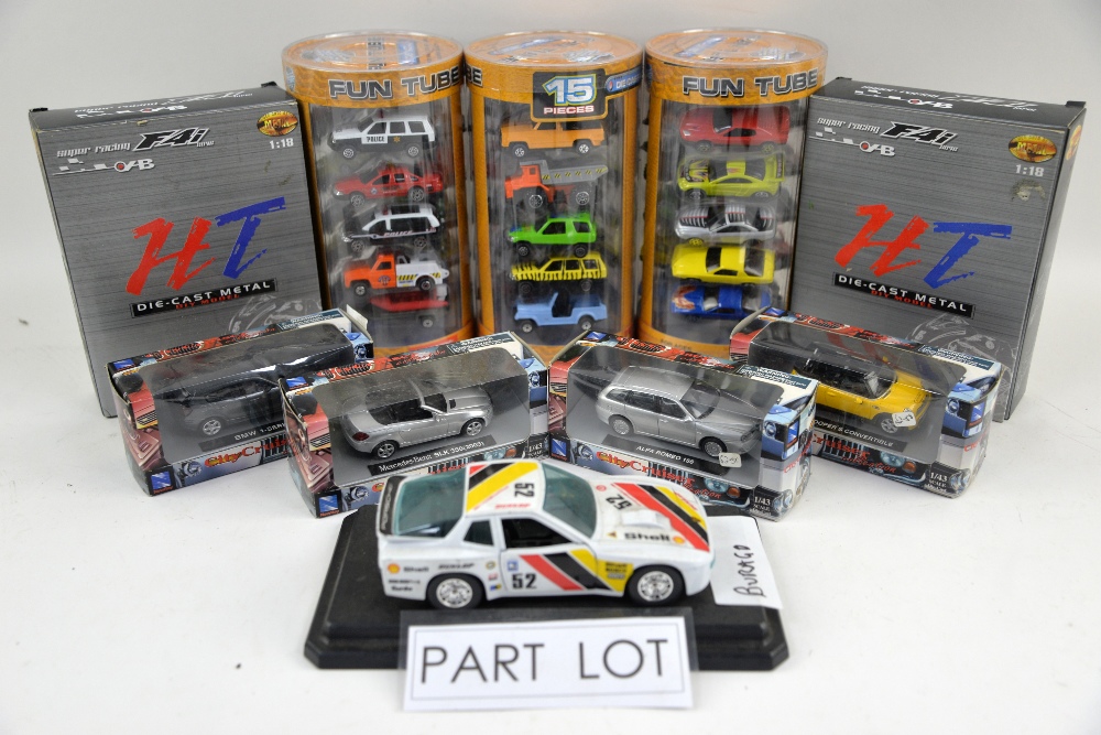 A quantity of boxed diecast models, mostly motorbikes and racing cars, including Burago and Super