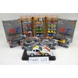 A quantity of boxed diecast models, mostly motorbikes and racing cars, including Burago and Super