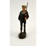 A group of Britains beefeater and piper painted figurines together with a collection of