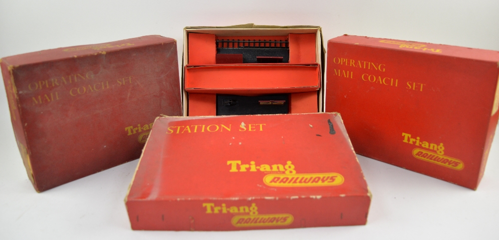 Three Tri-ang Railways Operating Mail Coach Sets and a Station Set, all boxed, completeness