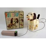A Japanese Alps battery operated rotary switch controlled 'Perky Pup' toy and a Honk Kong made '