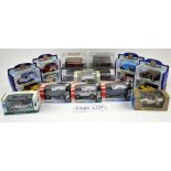 A quantity of boxed diecast models, mostly classic cars, buses and vans, including Ertl, Onyx,