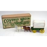 A Modern Product 'Covered Wagon' with four horses, made in England, accompanied with original box..