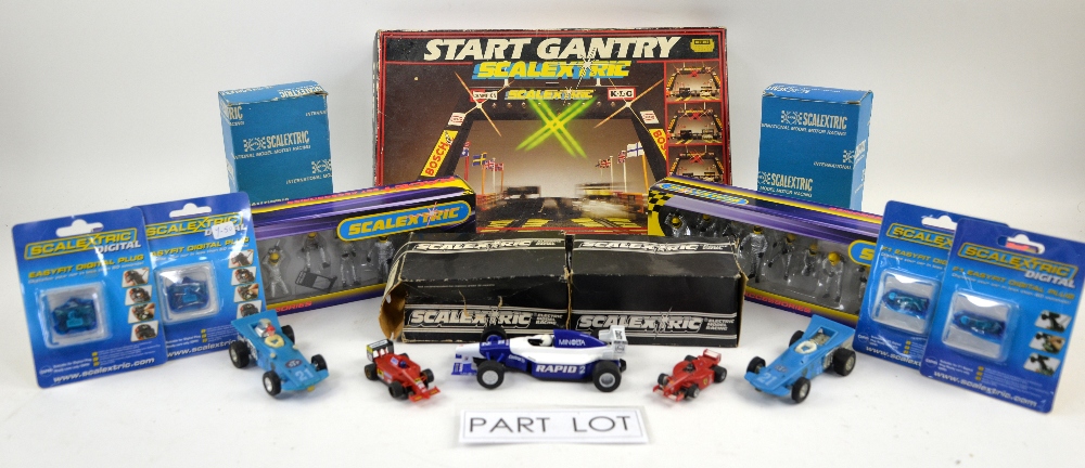 A quantity of Scalextric race cars and boxed accessories including Refuel C8302, Start Light