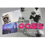 Oasis - Signed 10 x 8 promo photo signed by Liam, Noel, Gem, Andy Bell and Alan White in a 'Standing