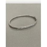 18CT WHITE GOLD BANGLE SET WITH 18 DIAMONDS APPROX 1.