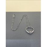 18CT DIAMOND RING ON WHITE METAL CHAIN (can be worn as a ring or pendant)