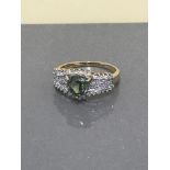 YELLOW GOLD DIAMOND AND GREEN STONE RING