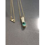 14CT YELLOW GOLD DIAMOND AND GREEN STONE PENDANT AND CHAIN