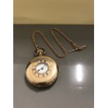 HALF HUNTERS POCKET WATCH ON 9CT GOLD ALBERT CHAIN