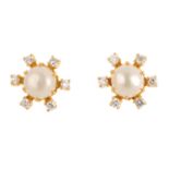 A pair of cultured pearl and diamond cluster earrings. Each designed as a cultured pearl, within a