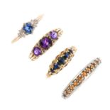 Four 9ct gold gem-set rings. To include a sapphire five-stone ring, an amethyst and diamond dress