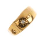An 18ct gold diamond ring. Designed as a buckle, with old-cut diamond highlight and tapered band.