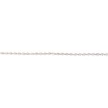 An 18ct gold diamond bracelet. The brilliant-cut diamond line, with textured bar spacers and