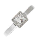 A platinum diamond single-stone ring. The square-shape diamond, within a collet mount, to the