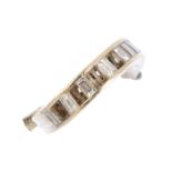 A diamond ring mount. The baguette-cut diamond line, with four rectangular-shape vacant settings and