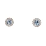 A pair of 18ct gold aquamarine and diamond stud earrings. Each designed as a circular-shape