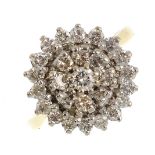 A 1970's 18ct gold diamond cluster ring. Set throughout with brilliant-cut diamonds. Estimated total