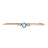 An aquamarine and diamond bar brooch. The oval-shape aquamarine collet, with old-cut diamond