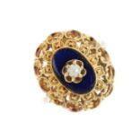 A seed pearl and enamel dress ring. The seed pearl, atop an oval blue enamel panel, with openwork