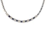 A sapphire and diamond necklace.