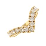 An early 20th century 18ct gold diamond dress ring. Designed as a brilliant-cut diamond chevron,