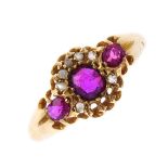 A mid Victorian 18ct gold ruby and diamond ring. The circular-shape ruby, with rose-cut diamond