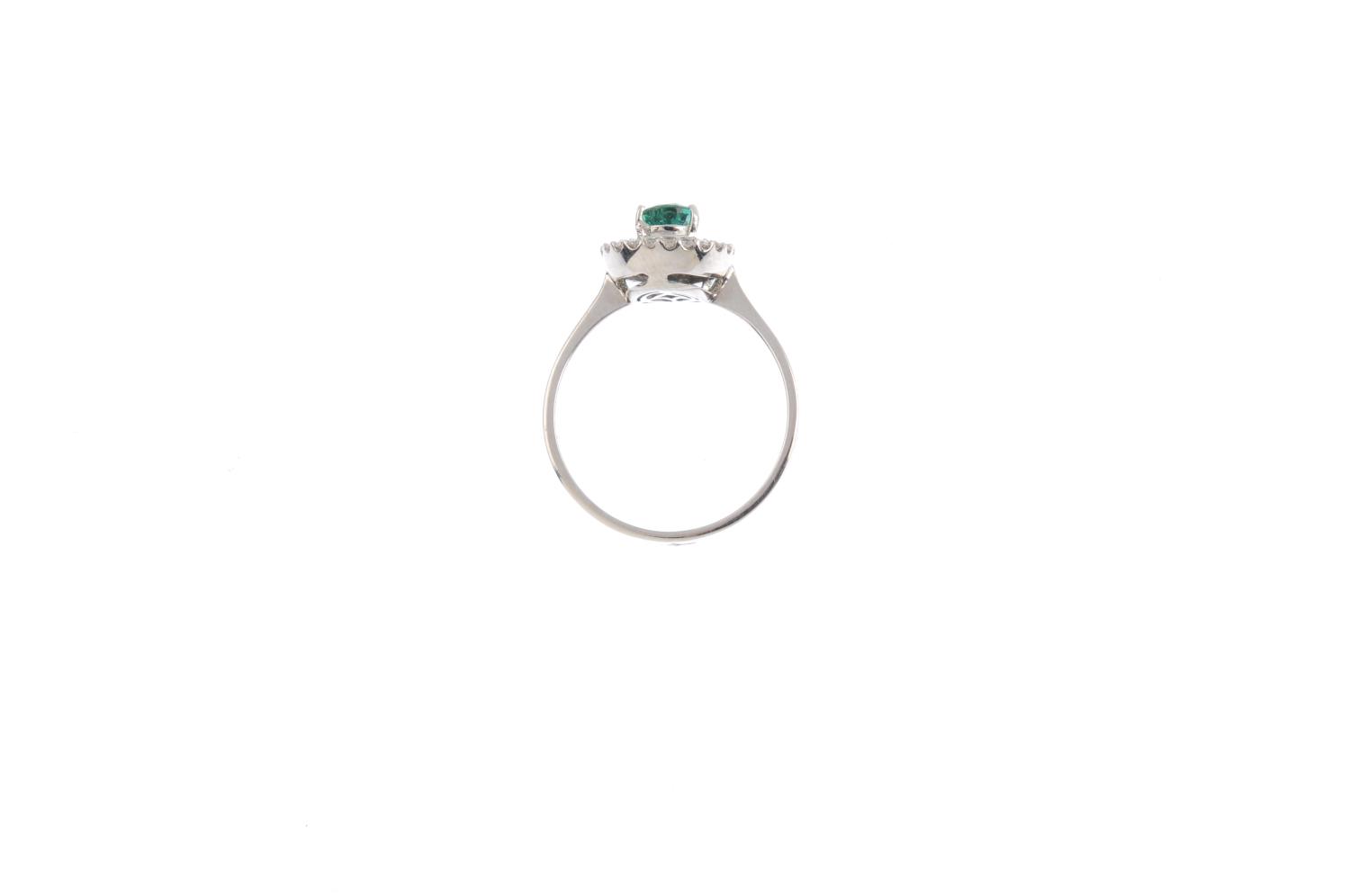 An emerald and diamond cluster ring. The pear-shape emerald, with vari-cut diamond surround. Emerald - Image 2 of 3