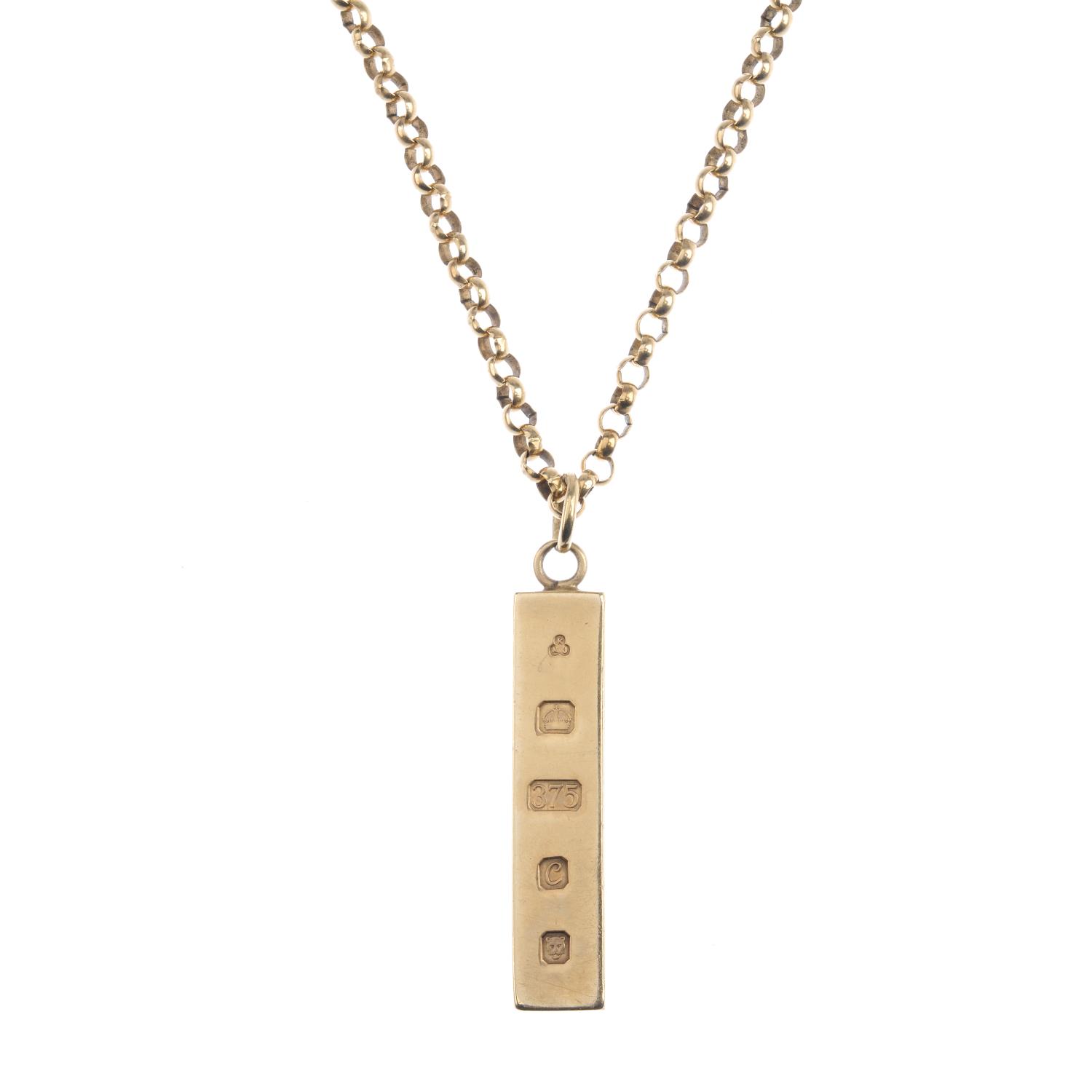 (52407) A 9ct gold pendant, with chain. Designed as a rectangular ingot bar, suspended from a