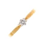 An 18ct gold diamond single-stone ring. The brilliant-cut diamond to the tapered shoulders.