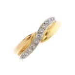 An 18ct gold diamond crossover ring. Of tri-colour design, with a curved brilliant-cut diamond