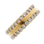An 18ct gold diamond band ring. The polished band, with brilliant-cut diamond line sides.